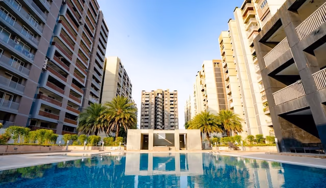 Apollo DB City – resident swimming pool set between the occupied towers