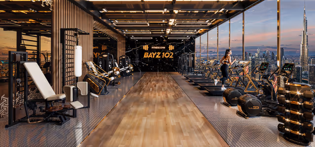 Bayz 102 – indoor fitness gym with skyline-facing glass walls