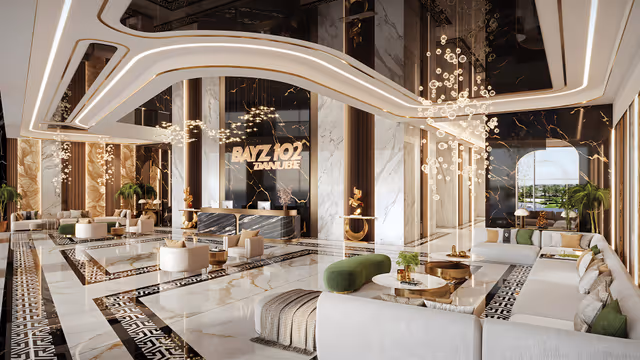 Bayz 102 – double-height marble lobby with reception and lounge seating