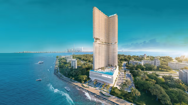 Breez by Danube – aerial view of the 60-floor oceanfront tower with the Downtown Dubai skyline behind