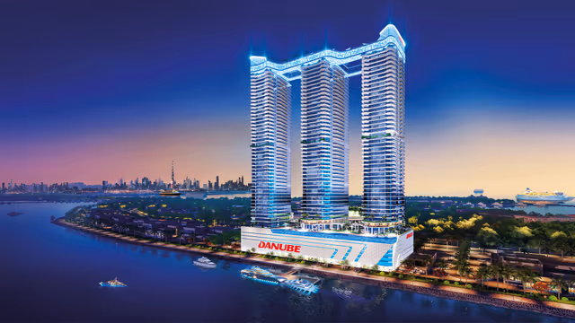 Oceanz 3 – towers lit at night over the marina