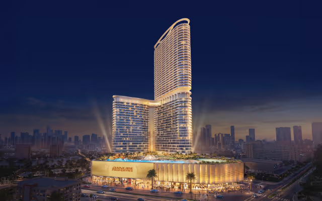 Serenz by Danube – 50-storey tower and podium retail illuminated at night