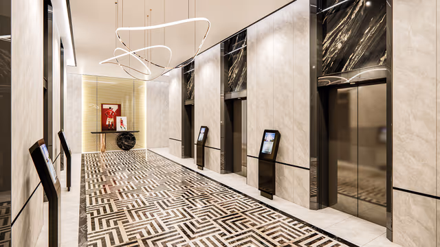 Sportz by Danube – marble lift lobby with digital directories