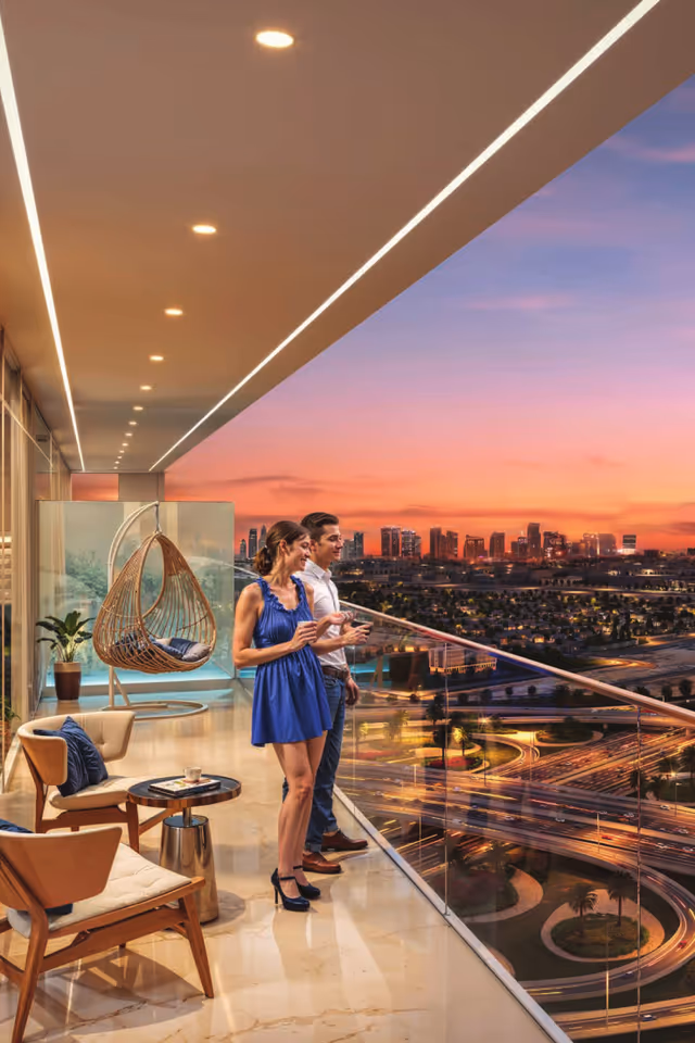 Timez by Danube – apartment balcony lounge at dusk over the interchange
