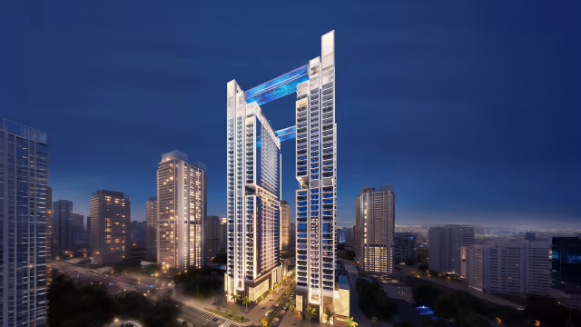 Viewz by Danube – twin 48-storey towers with lit skybridges at night, Jumeirah Lake Towers
