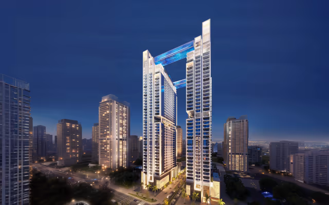 Viewz by Danube – twin 48-storey towers with lit skybridges at night, Jumeirah Lake Towers