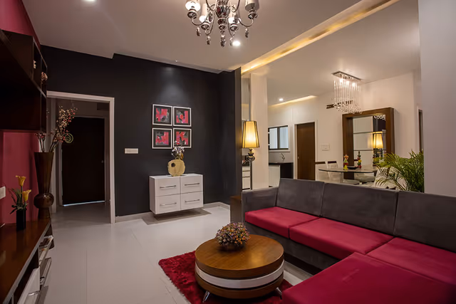 DB Pride – sample flat living room with the dining space beyond