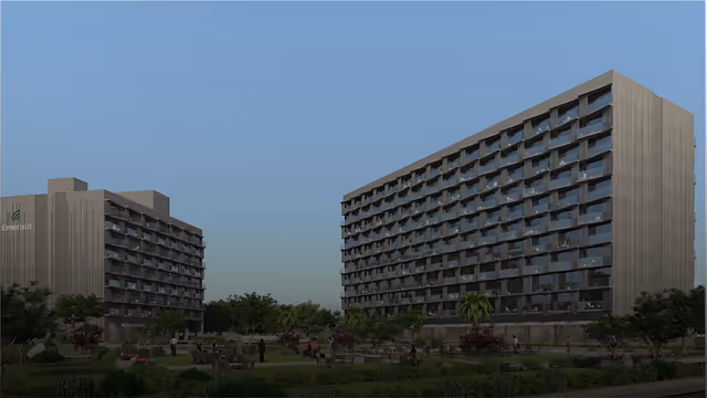 Emerald World Park – dusk view of the twin towers across the campus green