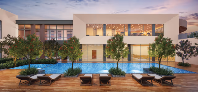 Godrej Greenview Estate – clubhouse pool deck with sun loungers at dusk